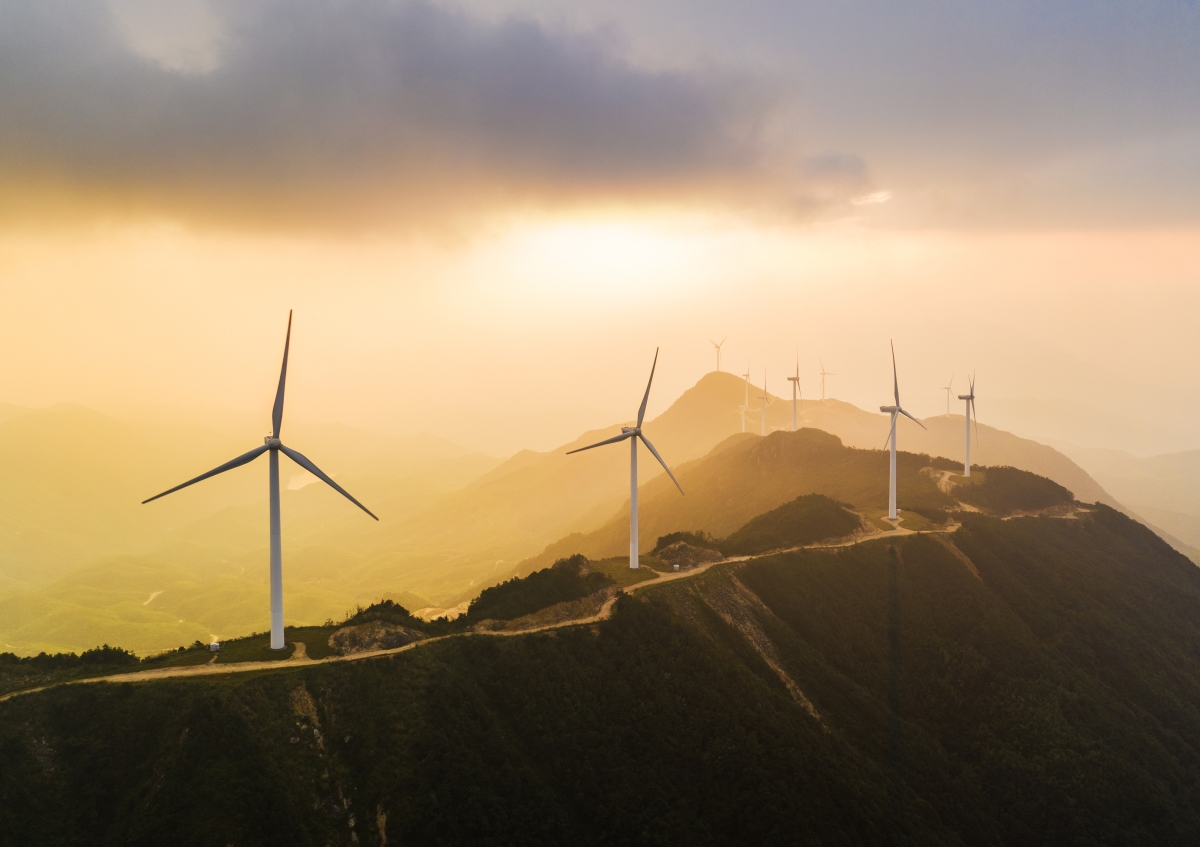 Wind farm on mountain ridge. High angle of view aerial shot