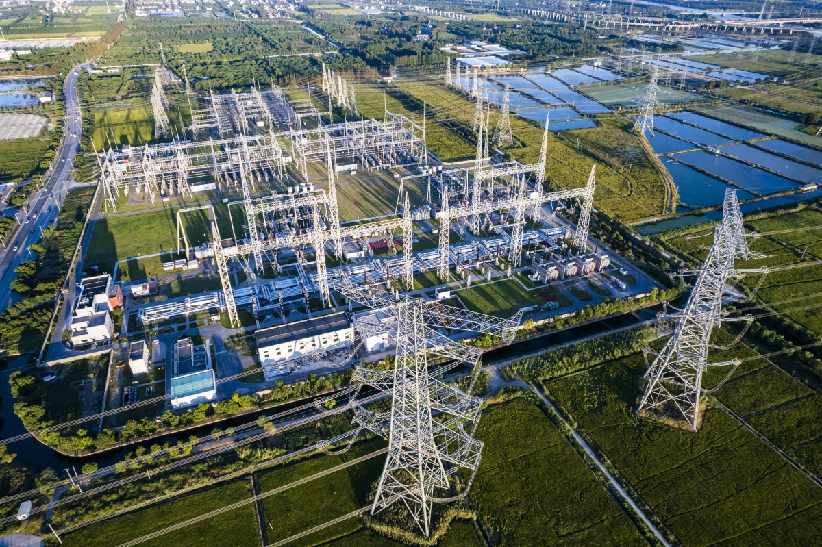 Aerial view of electricity pylons and a big electrical substation at Shanghai city, China